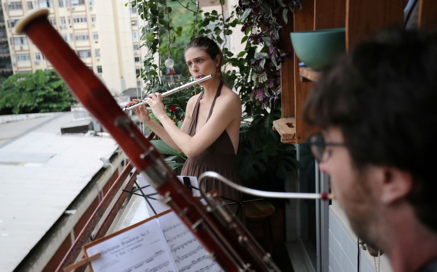 playing for neighbors from balcony