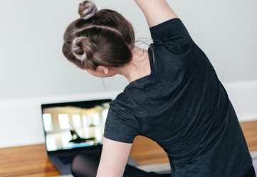 Woman participating in an online fitness class
